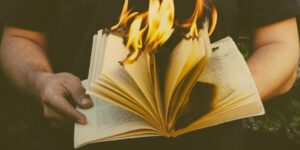 how-to-know-your-writing-is-bad-person-holding-burning-book